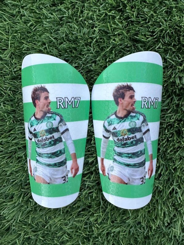 Standard personalised shin pads white and green stripes to match players kit.