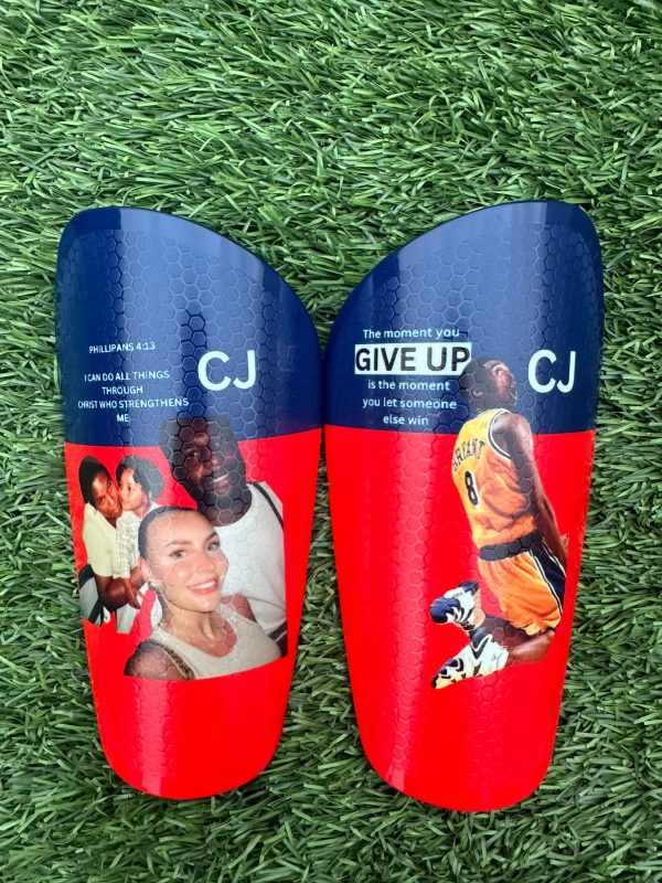 Pro personalised shin pads red and blue backdrop.