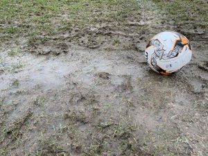 what is grassroots football muddy pitch and football