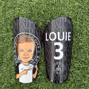 Cartoon personalised shin pads black and white with grassroots logo