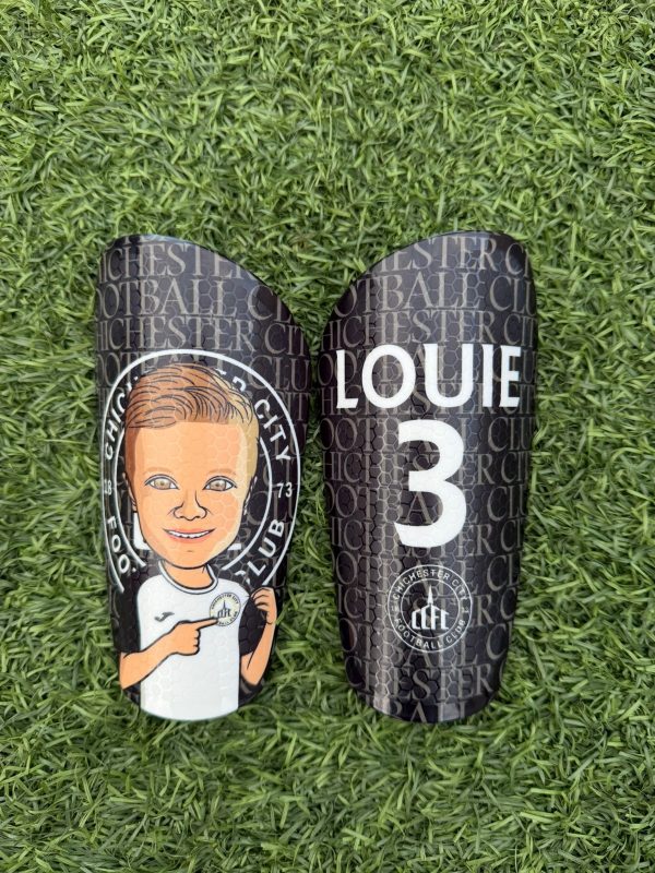Cartoon personalised shin pads black and white with grassroots logo