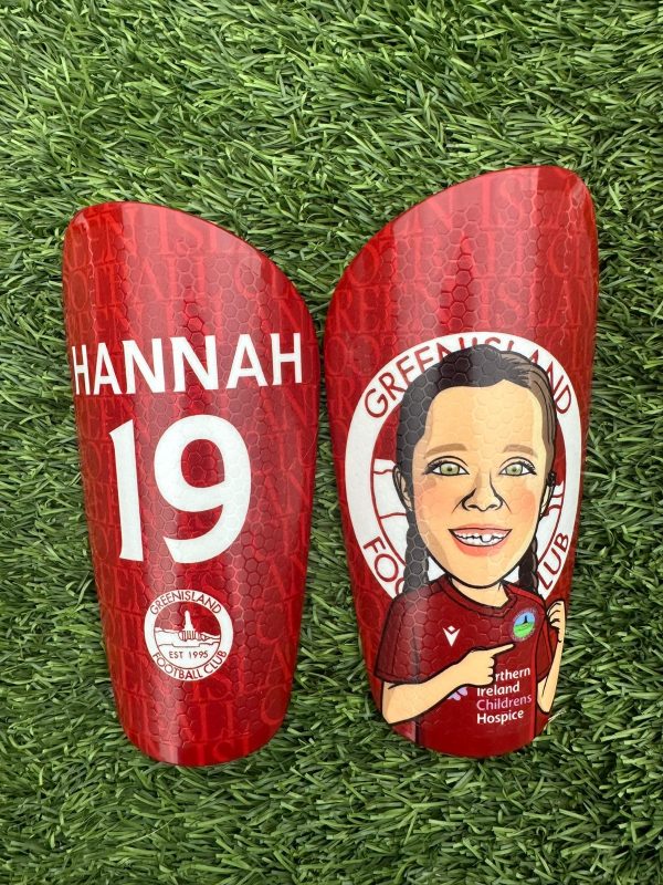 Cartoon personalised shin pads dark red back drop with grassroots logo