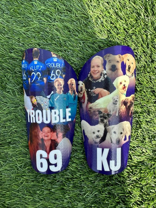 Elite personalised shin pads with family images, pets and white text.