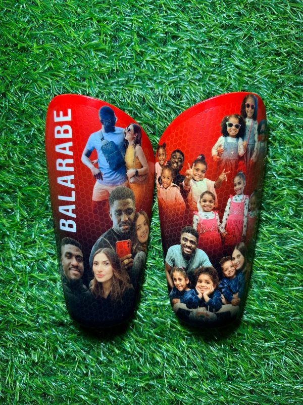 Elite personalised shin pads. red and black background with family images.