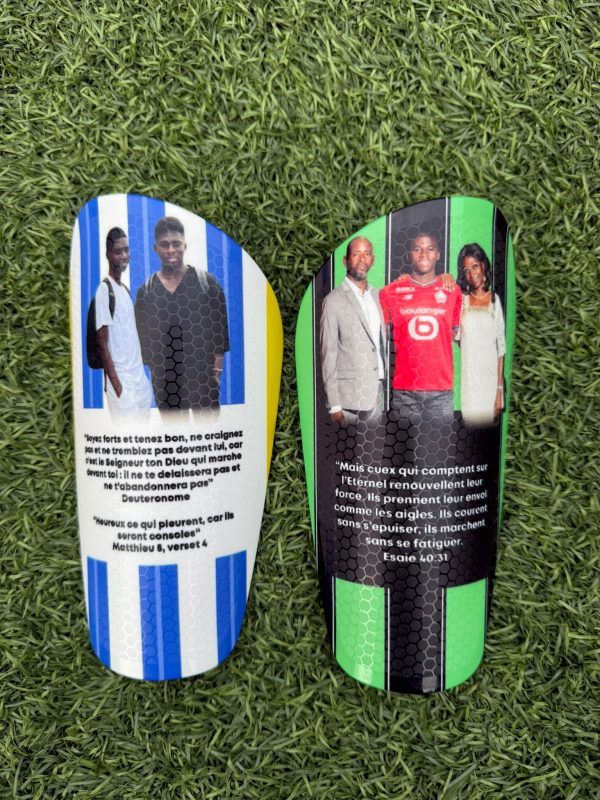 Elite personalised shin pads blue and white background with green and black background.