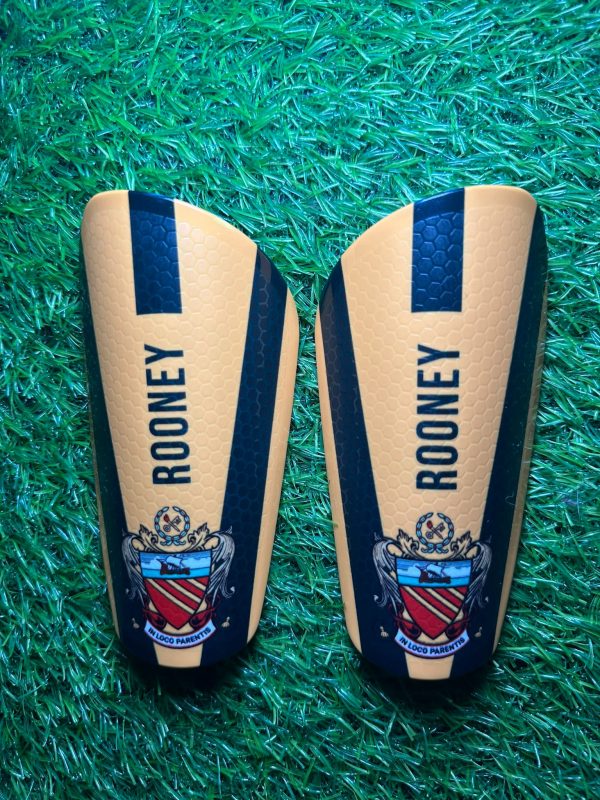 Elite personalised shin pads black and yellow pads with grassroots logo and Rooney text.
