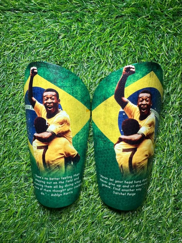 Elite personalised shin pads. Brazil backdrop and players celebrating goal.