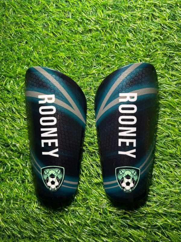 Elite personalised shin pads with Rooney text and grassroots logo.